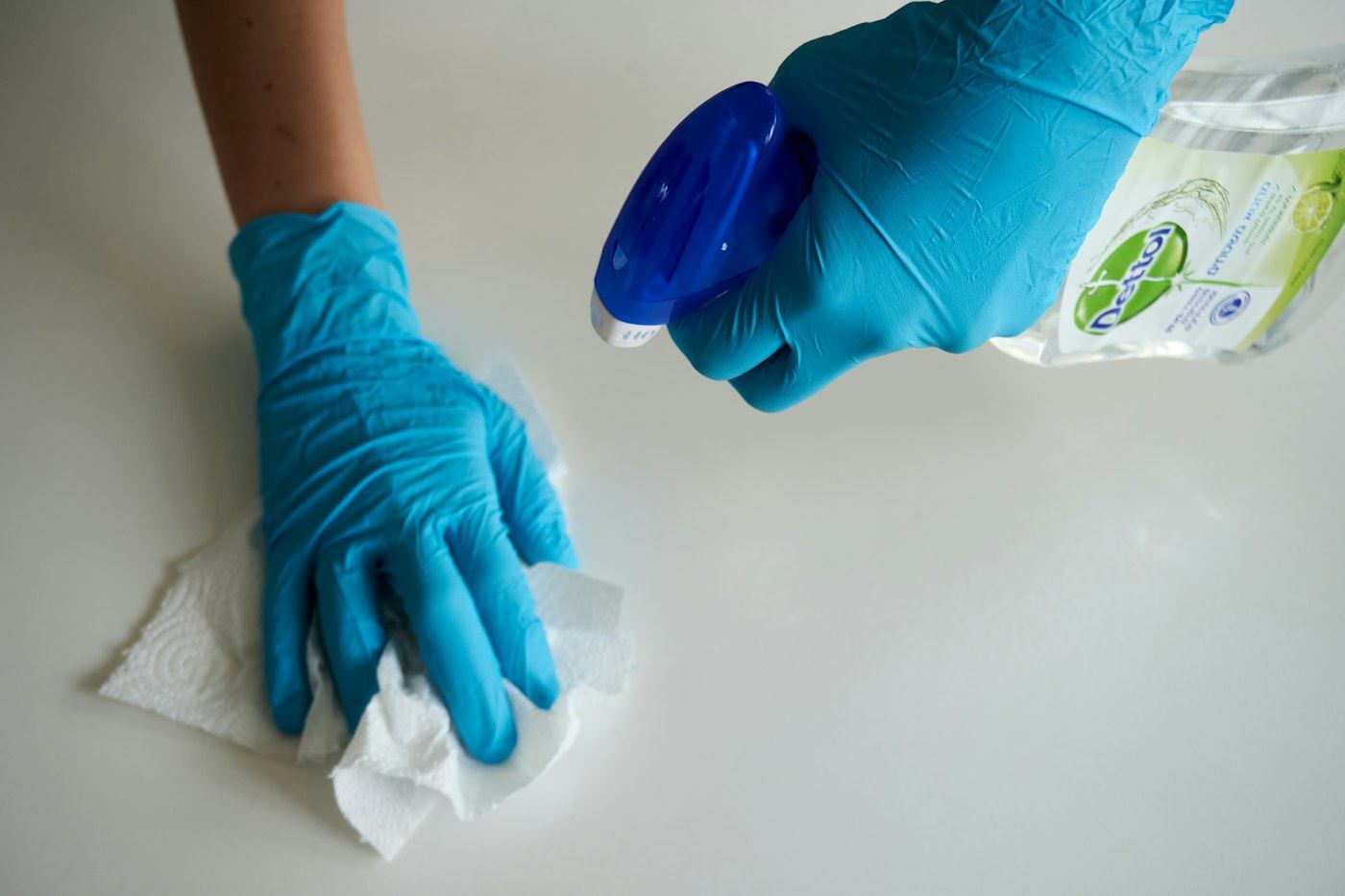 Wiping down a white countertop